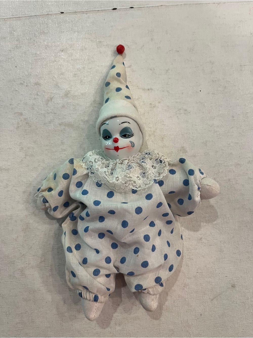 Vintage hand painted Porcelain clown in blue  polka dot jester suit. So cute!